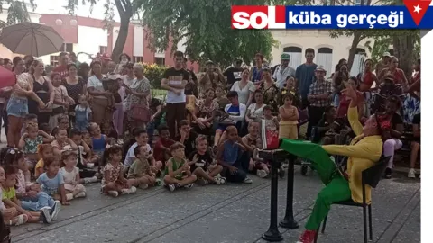 Küba bayrağı ve Birleşmiş Milletler binası temsili görseli.
